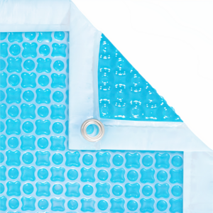 Manta térmica estandar de burbuja OXO Cristal de 500 micras de 6m x 3m con ribete en 1 lateral de 3m con ojales + protector de enrollador